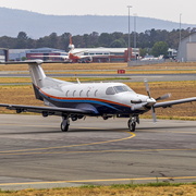 Australian Flight Operations (VH-UVE) Pilatus PC-12-47E taxiing at Canberra Airport